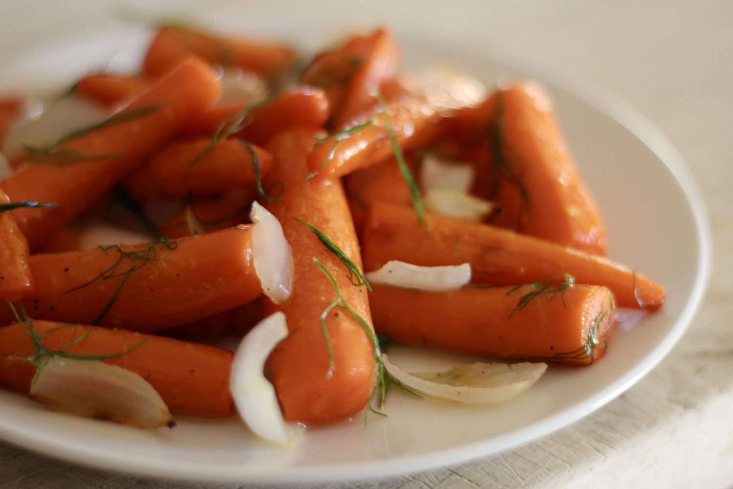 roasted carrots and onions with fennel fronds and honey