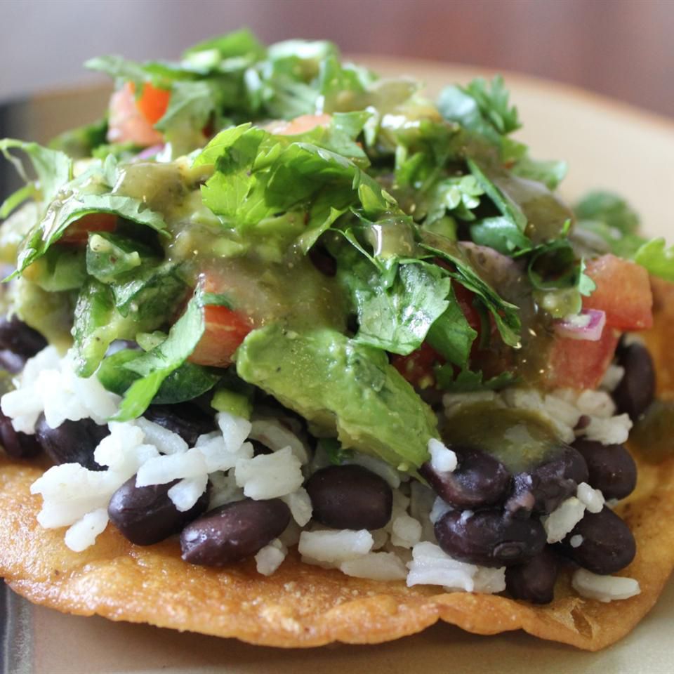 tortilla with rice beans, avocados, tomatoes, and cilantro