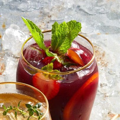 glass of Red Wine and Orange Sangria garnished with fresh mint