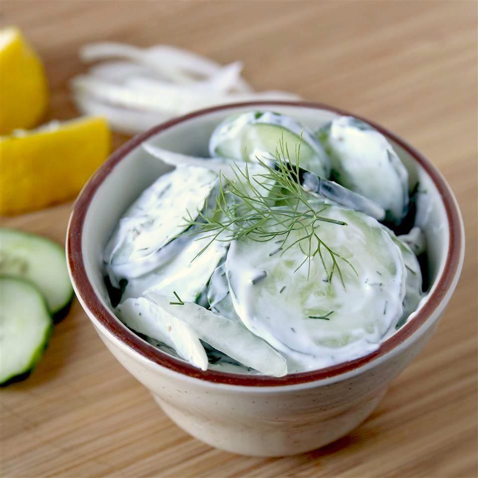 creamy cucumber salad in a ceramic bowl