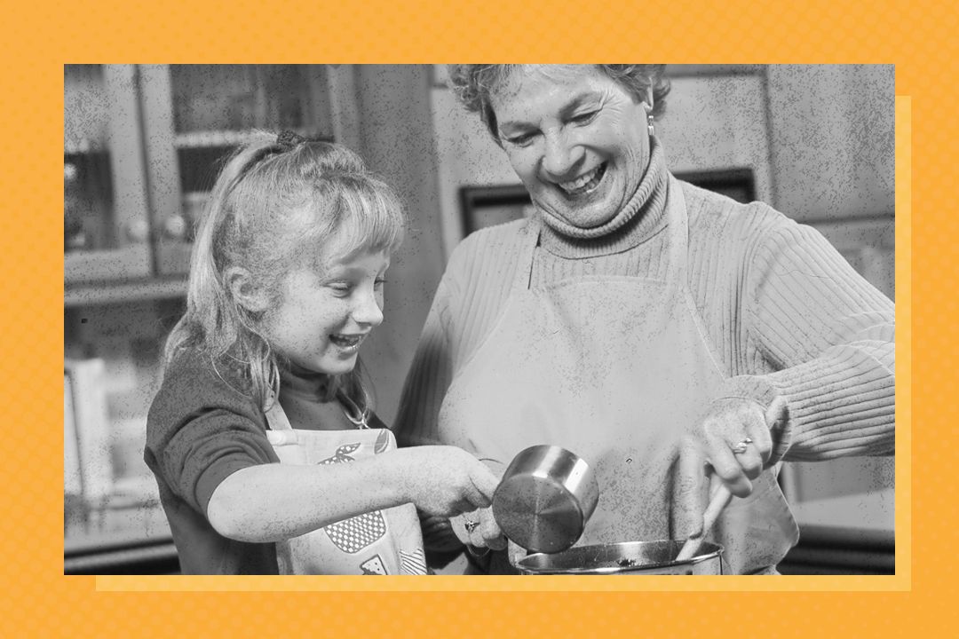 Girl And Grandma Adding Ingredients To Pot
