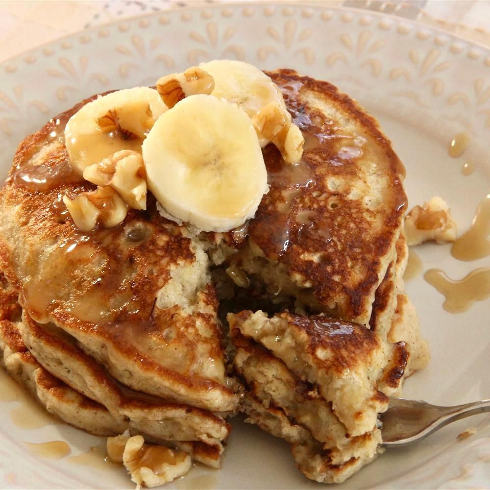 stack of banana pancakes with banana slices on top