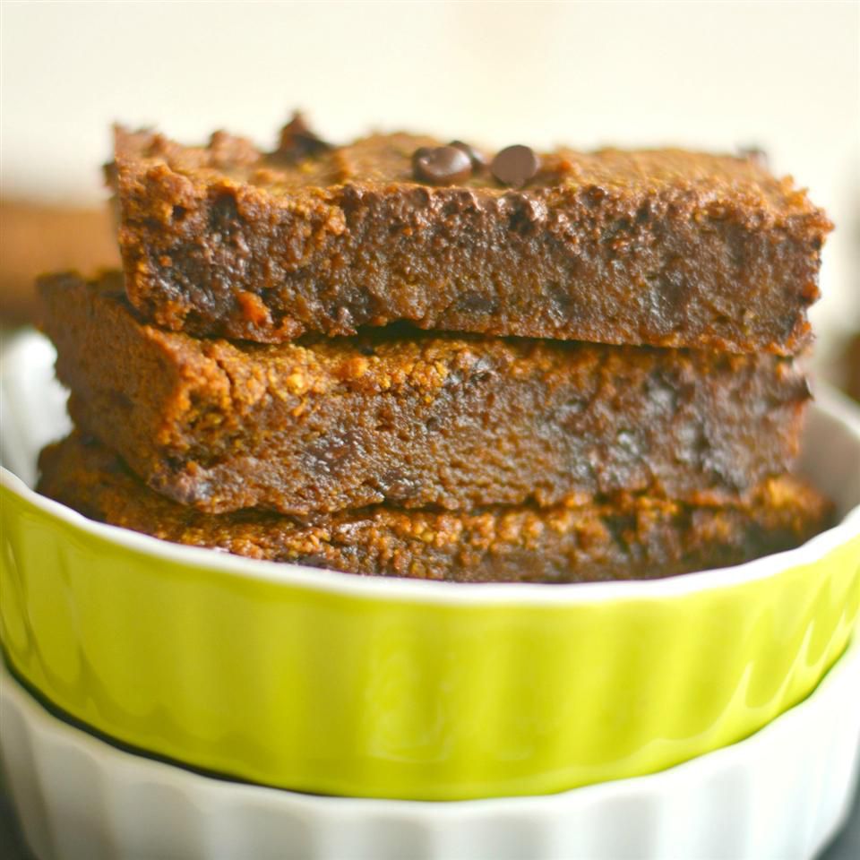<p>Warm, gooey, and gluten-free pumpkin chocolate bars should be next on your to-bake list. Coconut sugar and almond extract add a richness you'll want to taste over and over. </p>
                          