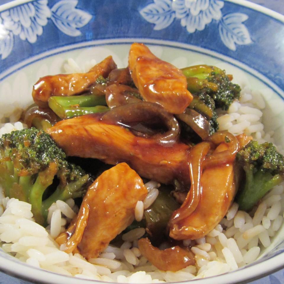 Broccoli and Chicken Stir-Fry on a white and blue plate