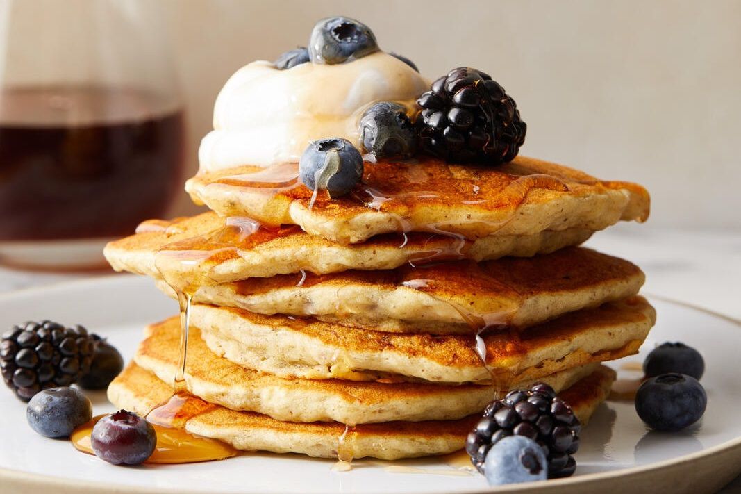 image?url=https%3A%2F%2Fstatic.onecms.io%2Fwp content%2Fuploads%2Fsites%2F43%2F2021%2F09%2F24%2Fon21 syrup pancakes with berries photo by meredith horiz crop