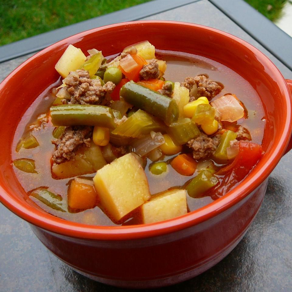 soup with vegetables and beef in bowl