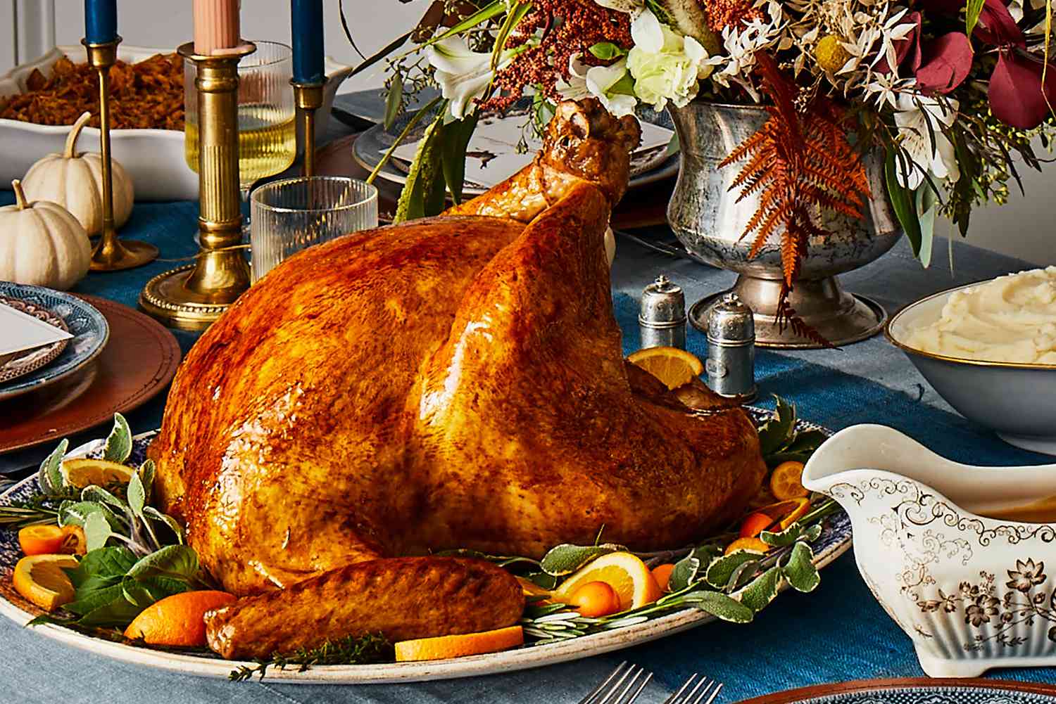 Juicy Thanksgiving Turkey sitting on a well dressed Thanksgiving table