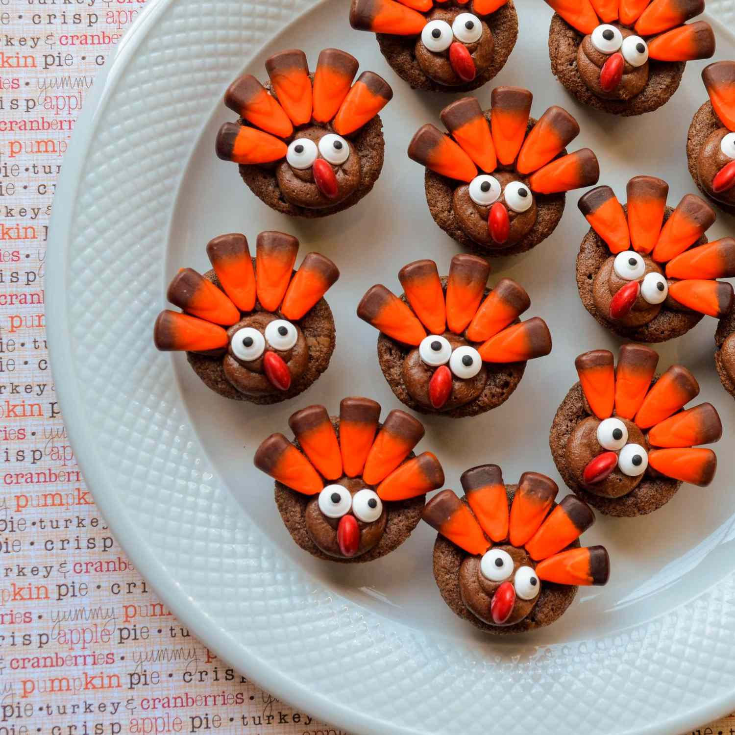 plate of Mini Turkey Brownies with candy corn feathers, googly eyes, and red candy noses