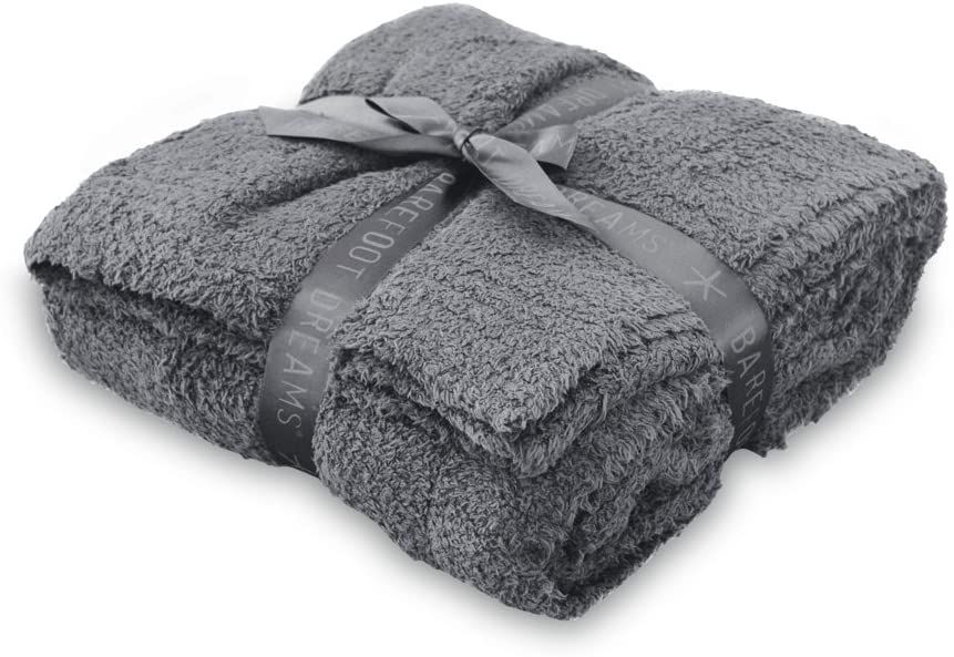 gray blanket folded with ribbon