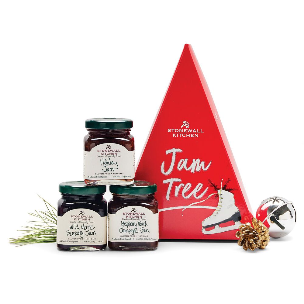 three jars of jam next to triangle gift box