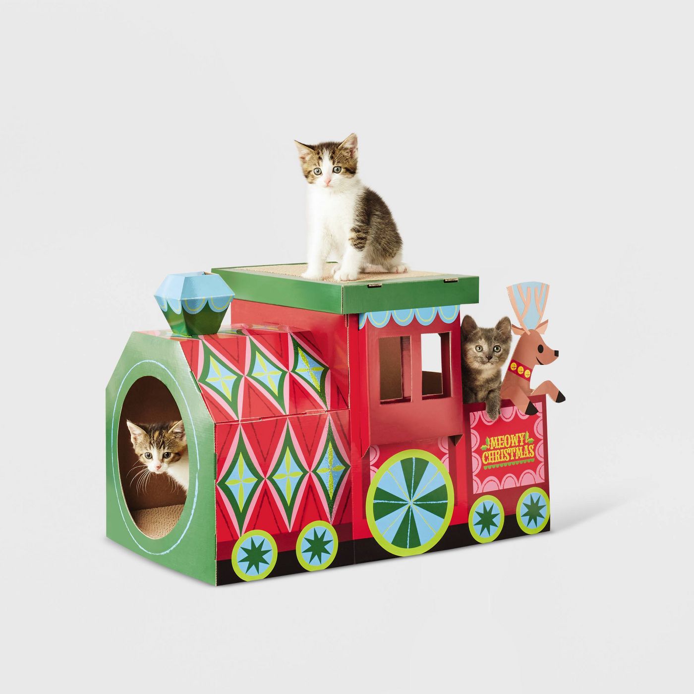 cardboard Christmas train with three kittens