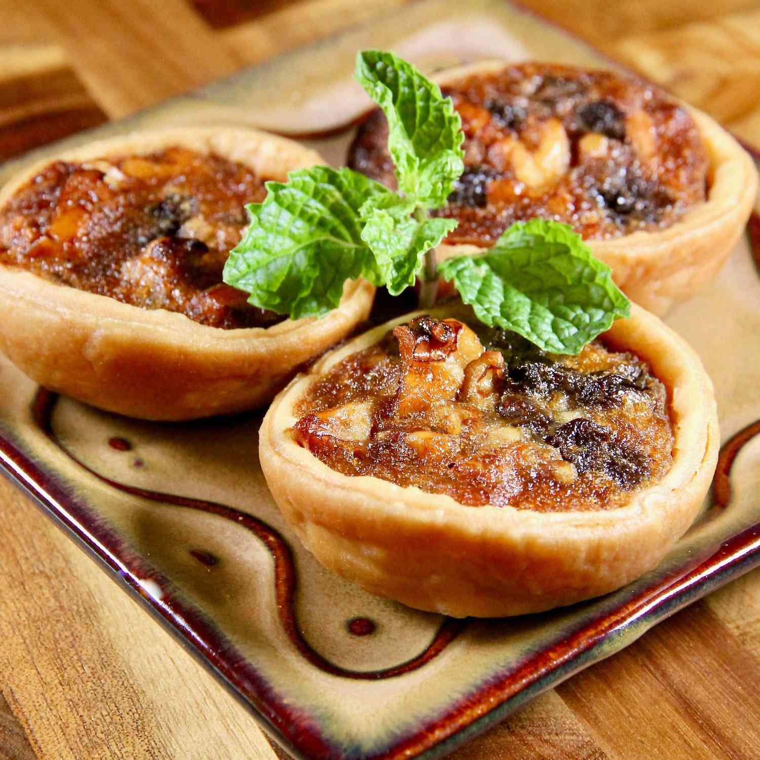 Mini Chess Pies on a small brown plate
