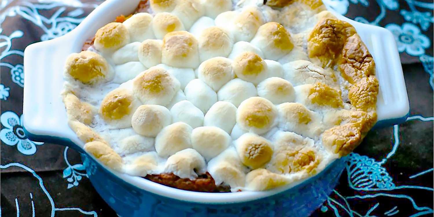 A close up view of easy sweet potato casserole topped with melty marshmallows