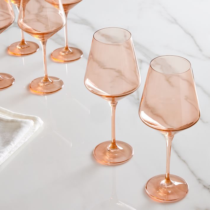 apricot colored stemmed wine glasses