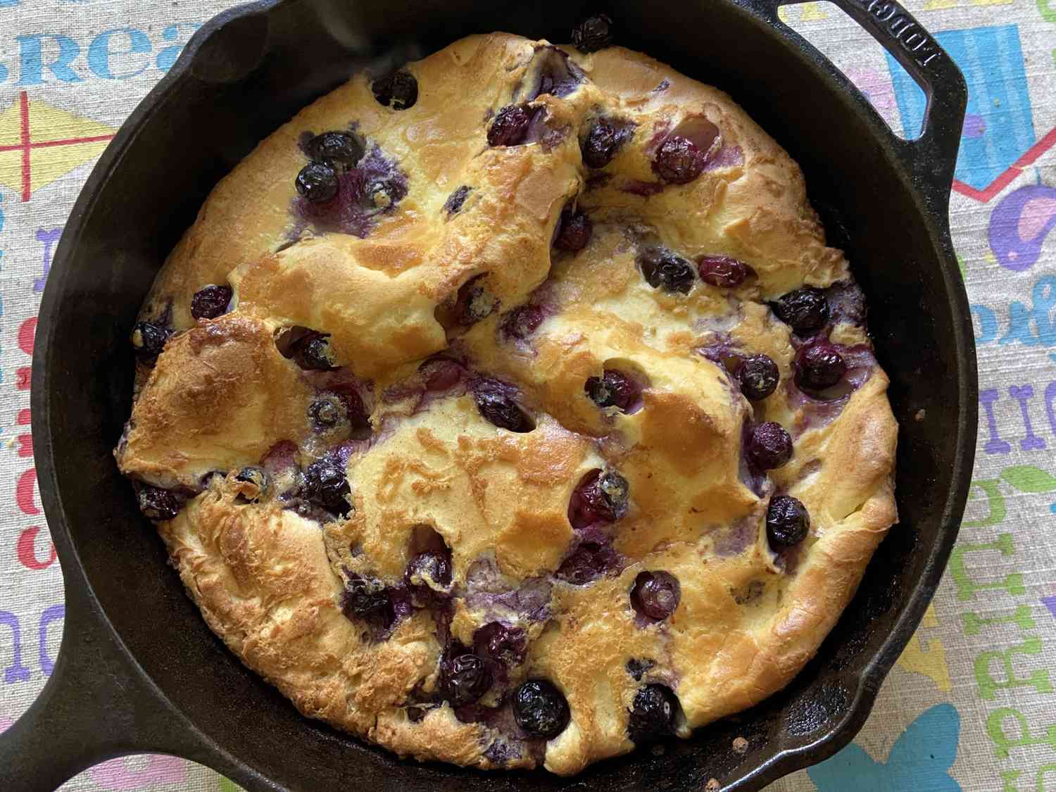 Chef John's Blueberry Dutch Baby baked in a cast iron skillet