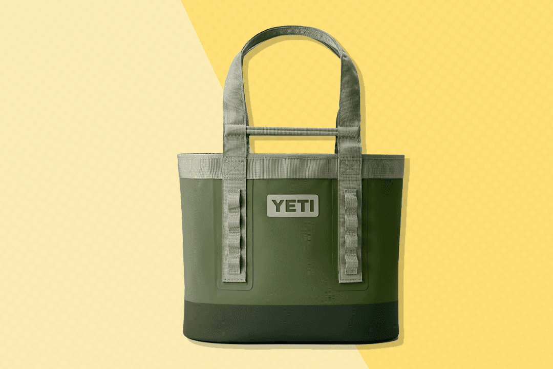 a green YETI Camino 35 Carryall with Internal Dividers on a two-tone yellow background