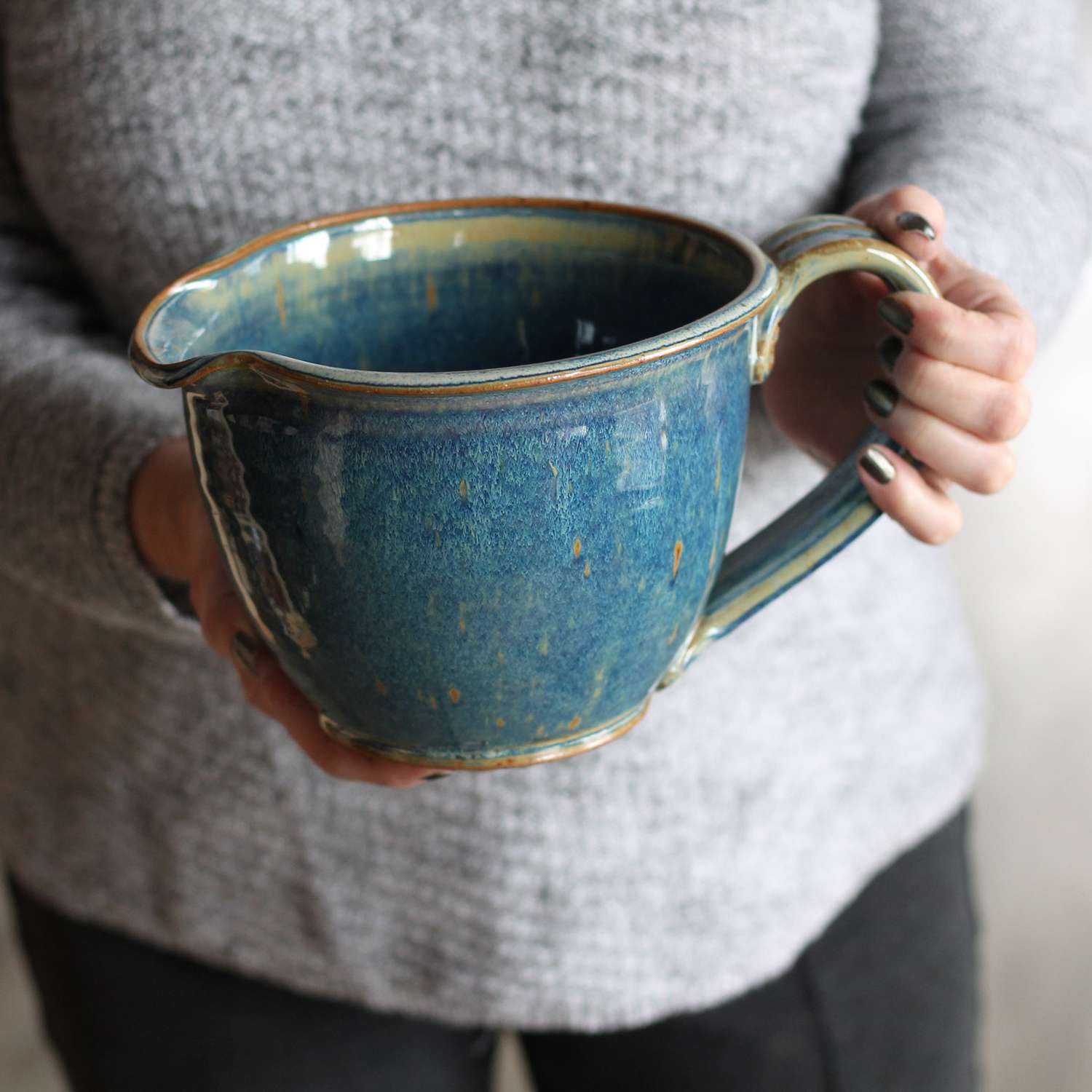 large ceramic pitcher in teal blue color
