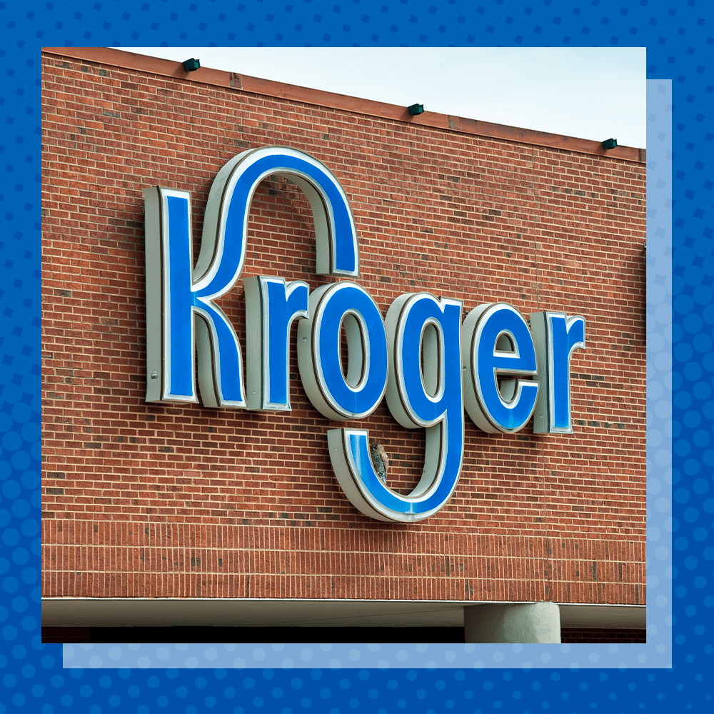 kroger logo on a brick wall with a blue frame