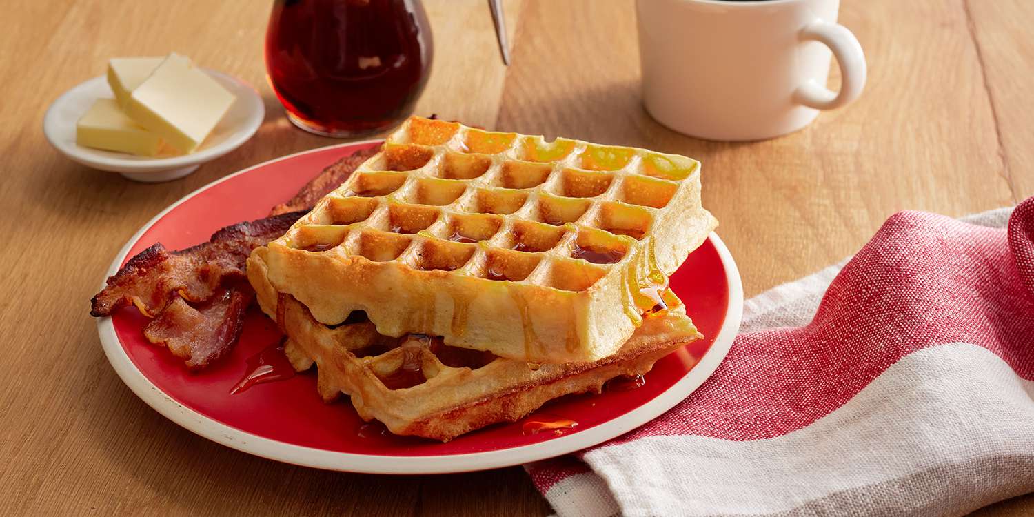 plate of waffles with bacon