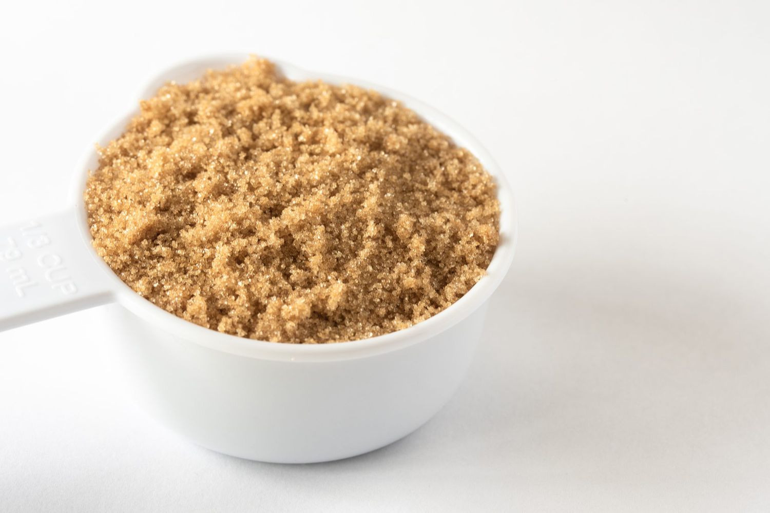 packed light brown sugar in measuring cup