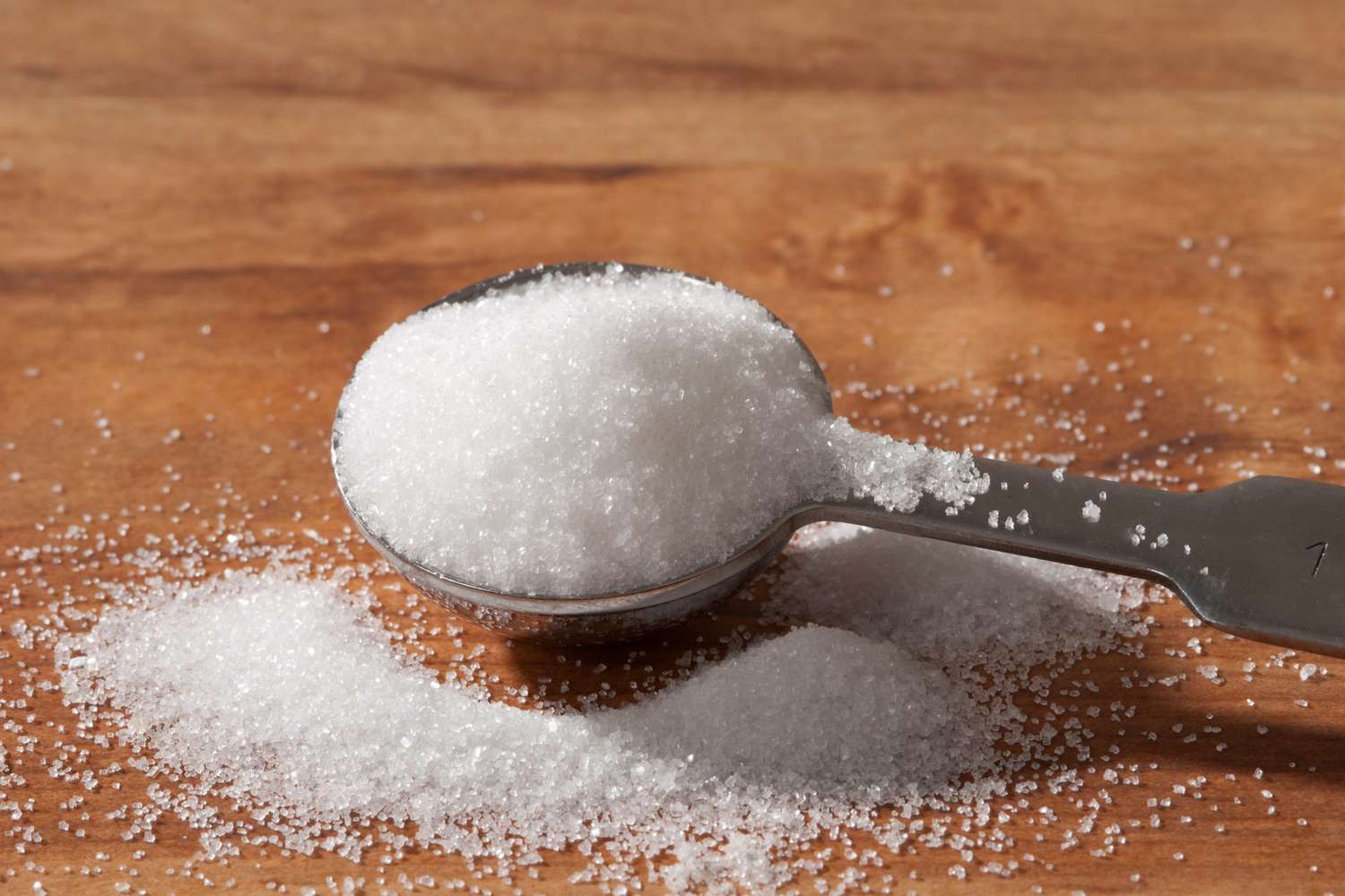 white granulated sugar in tablespoon