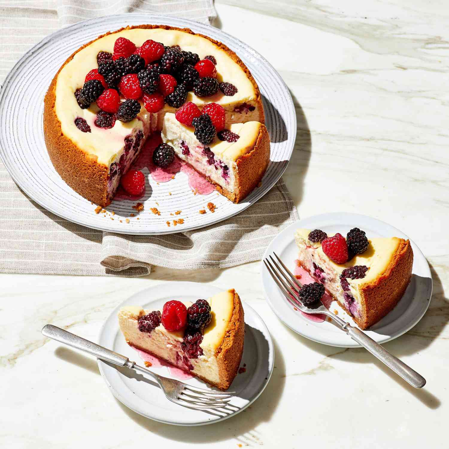 Crumb-crusted cheesecake topped with fresh berries