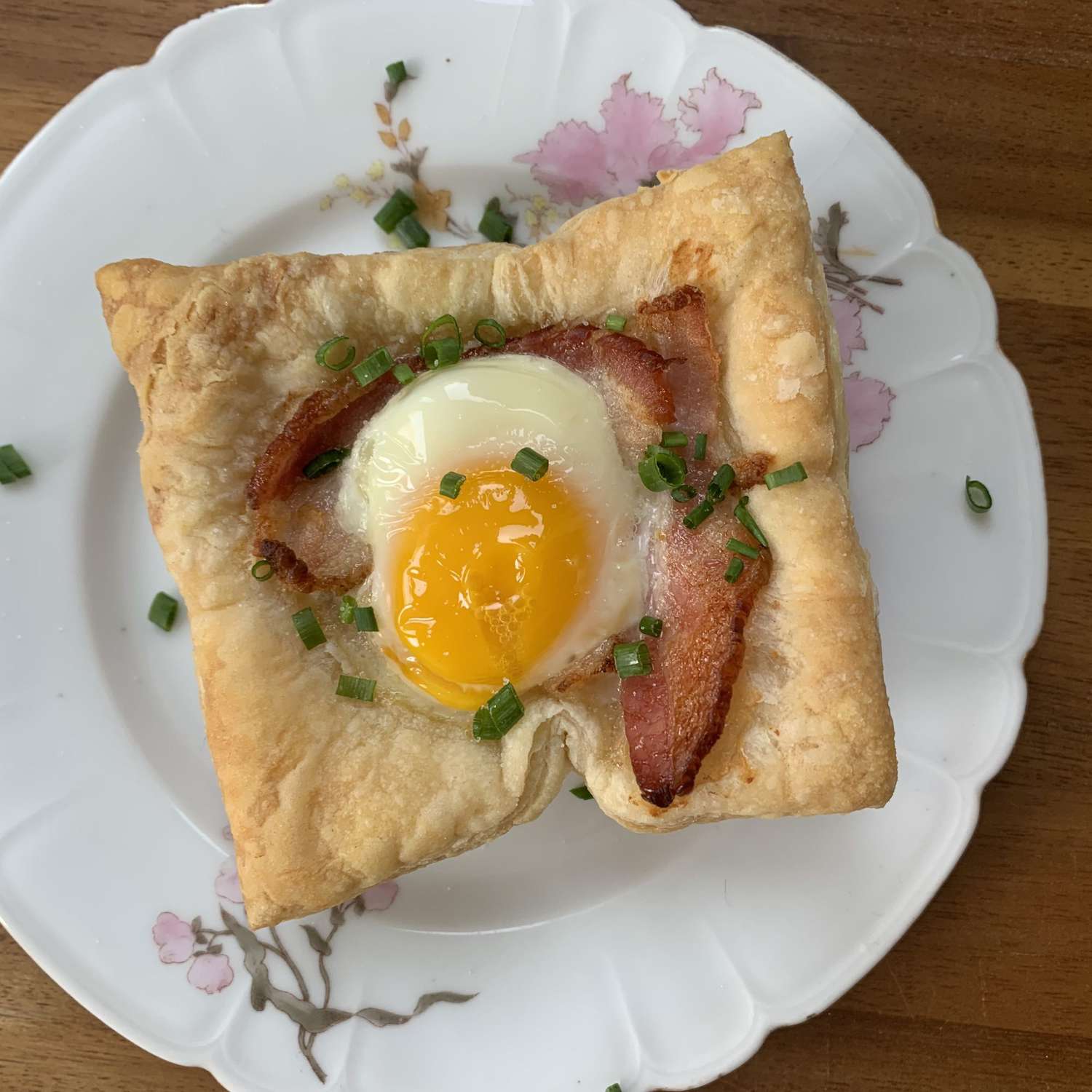 puff pastry with egg and bacon on plate