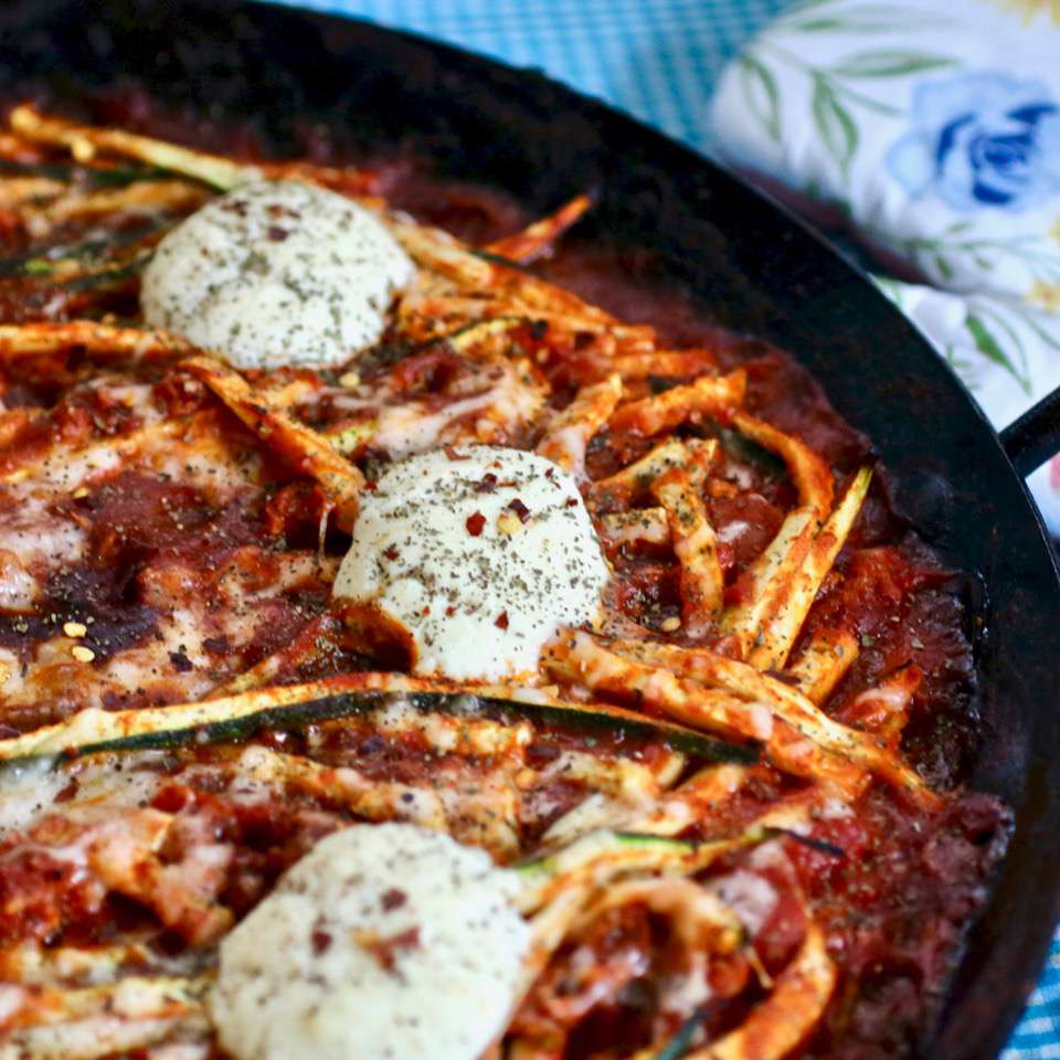 baked zucchini noodles in skillet