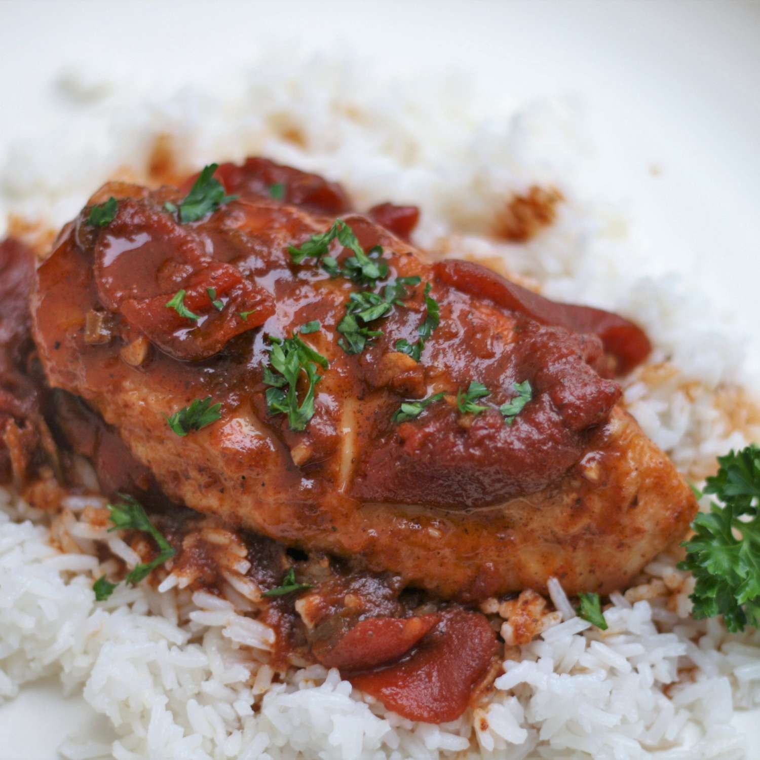 Chicken breasts Pierre with sauce on bed of rice