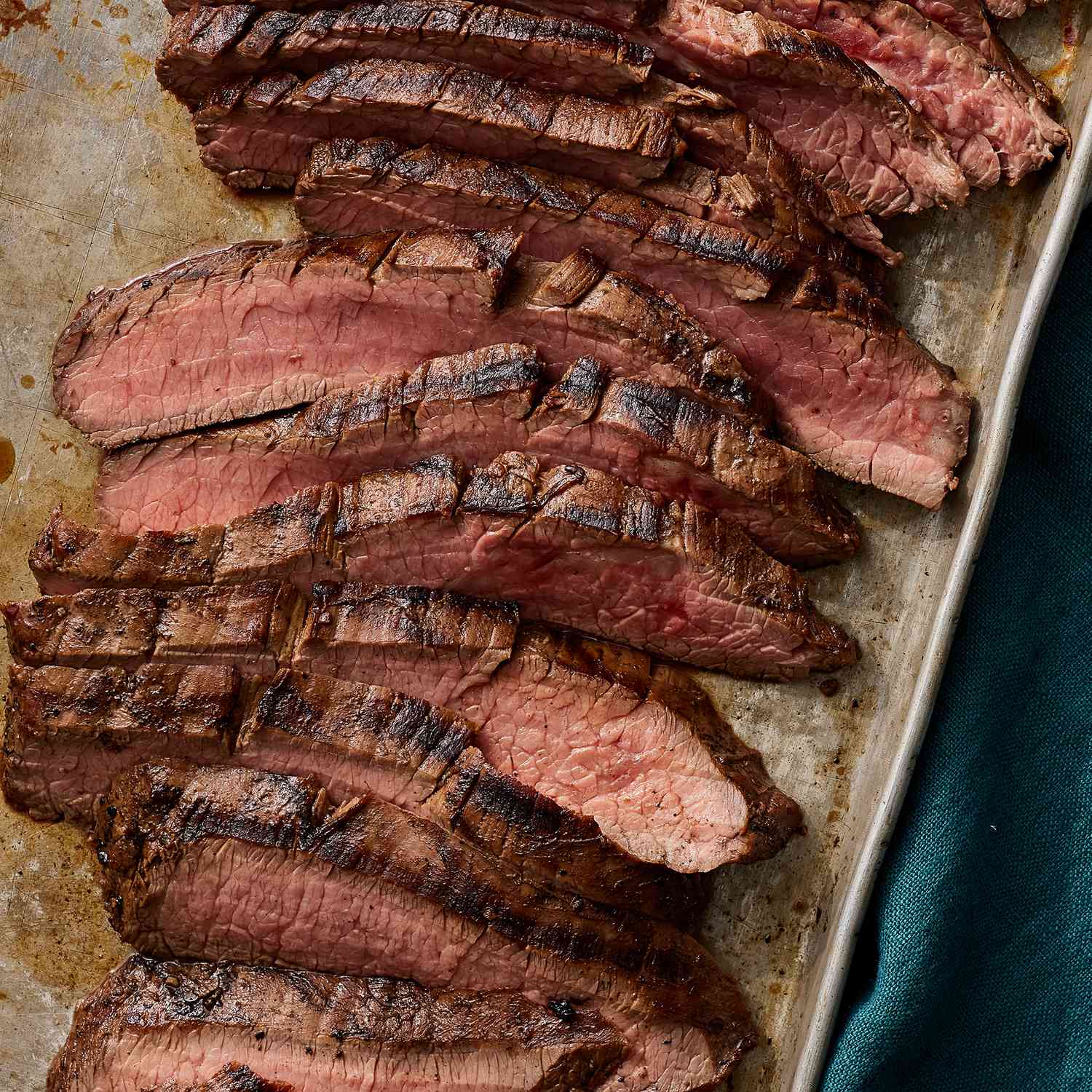 overhead view of sliced marinated flank steak