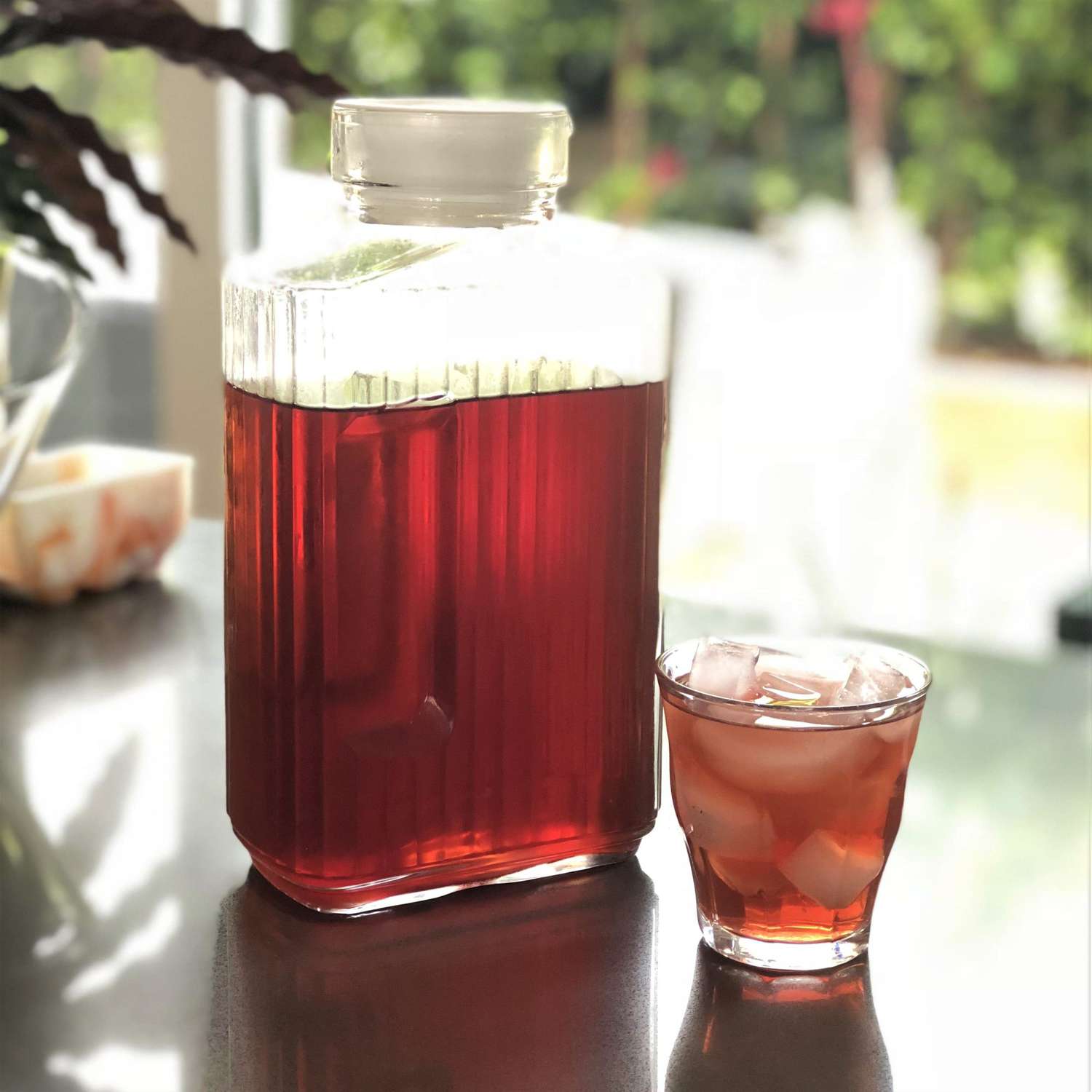 rose hip iced tea in a glass with ice