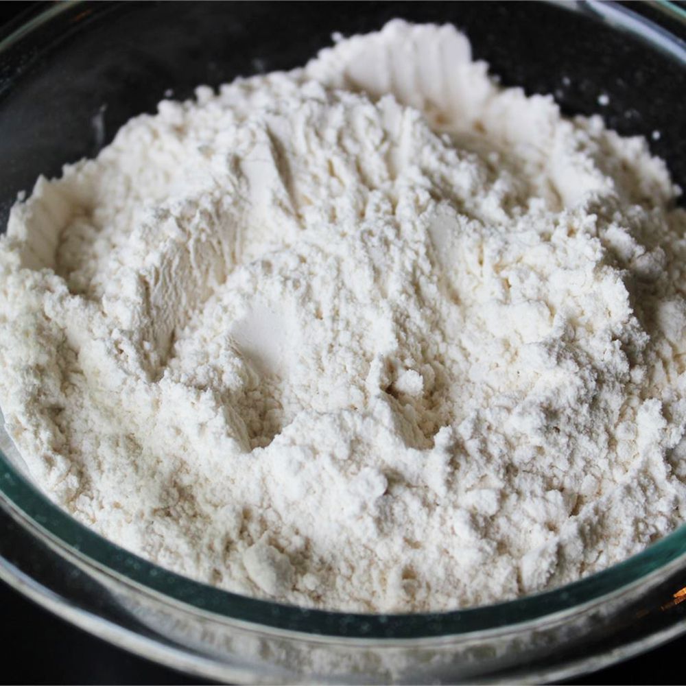 close up view of self-rising flour in a glass bowl