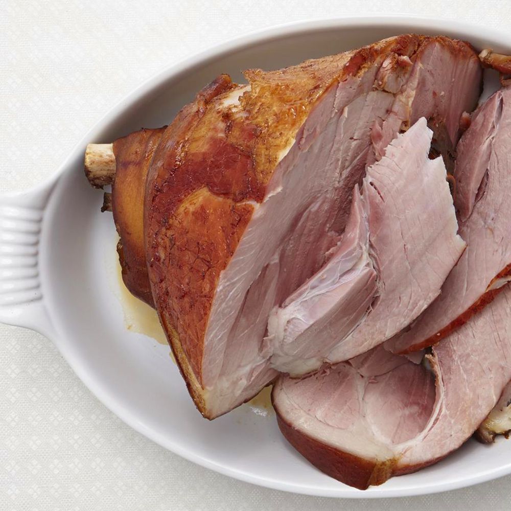 close up view of cooked ham in a baking dish