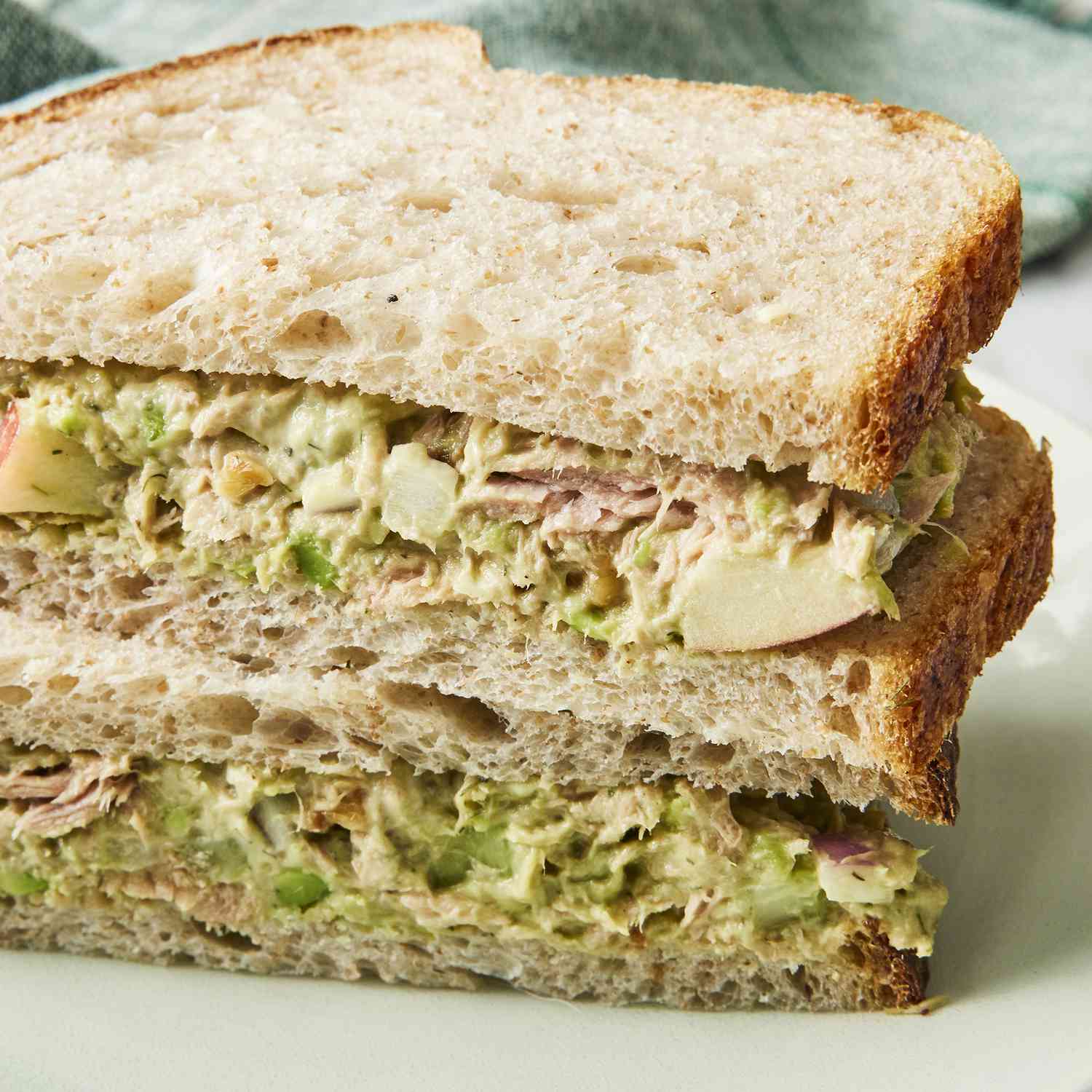 mid angle looking into avocado tuna salad cut in half and stacked on top of one another