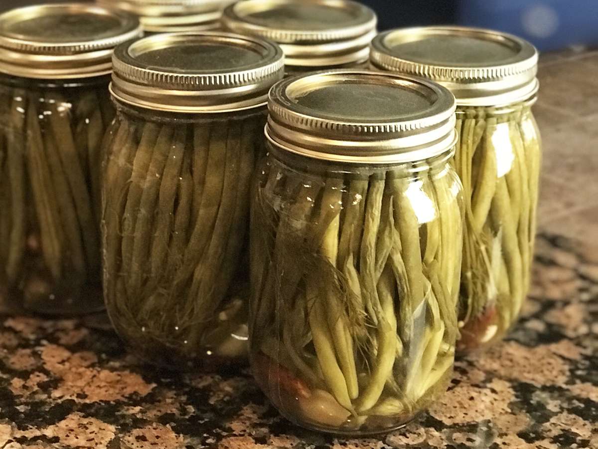 close up view of Crisp Pickled Green Beans in closed jars