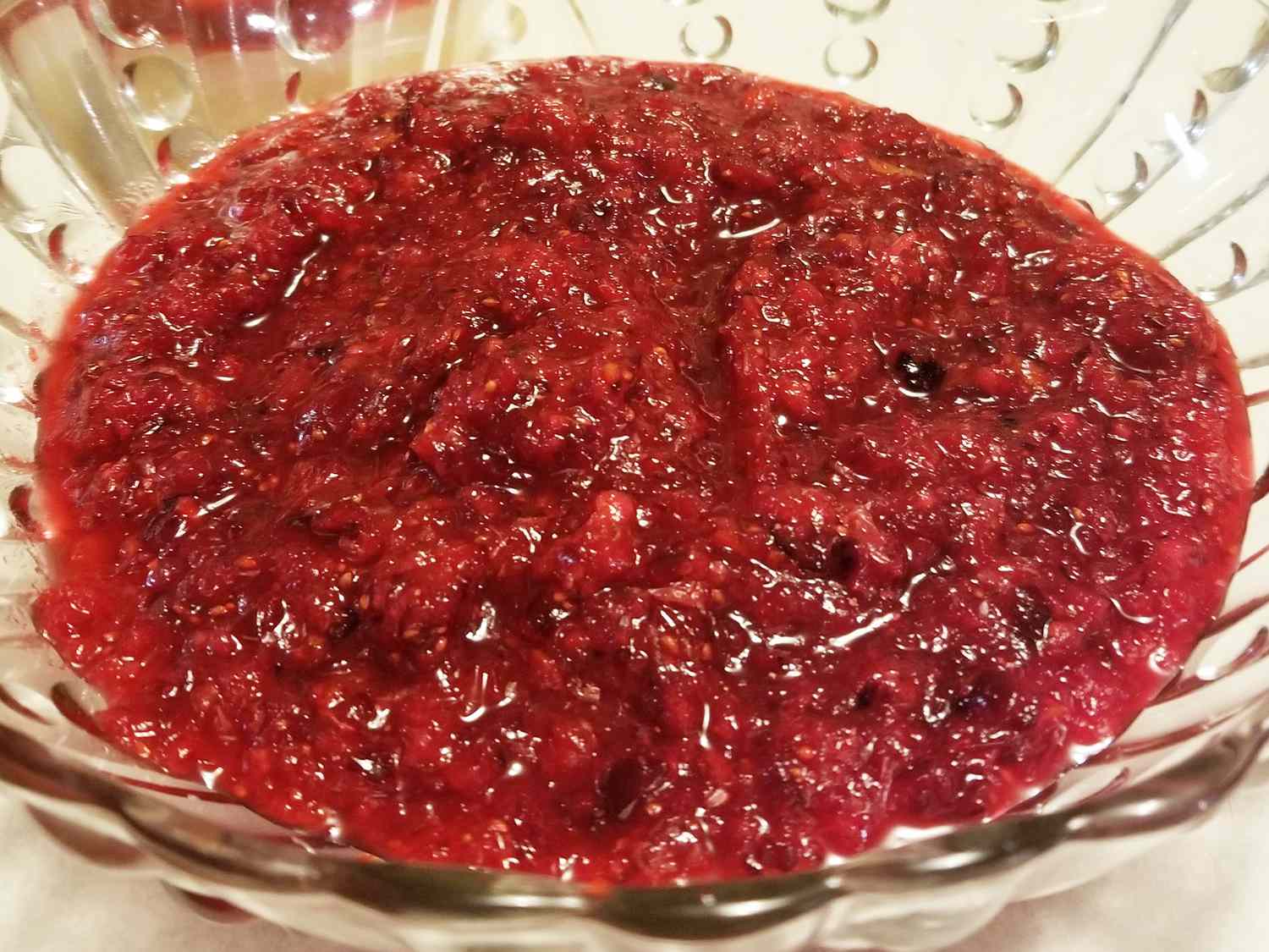 close up view of Easy Cranberry Orange Relish in a glass bowl