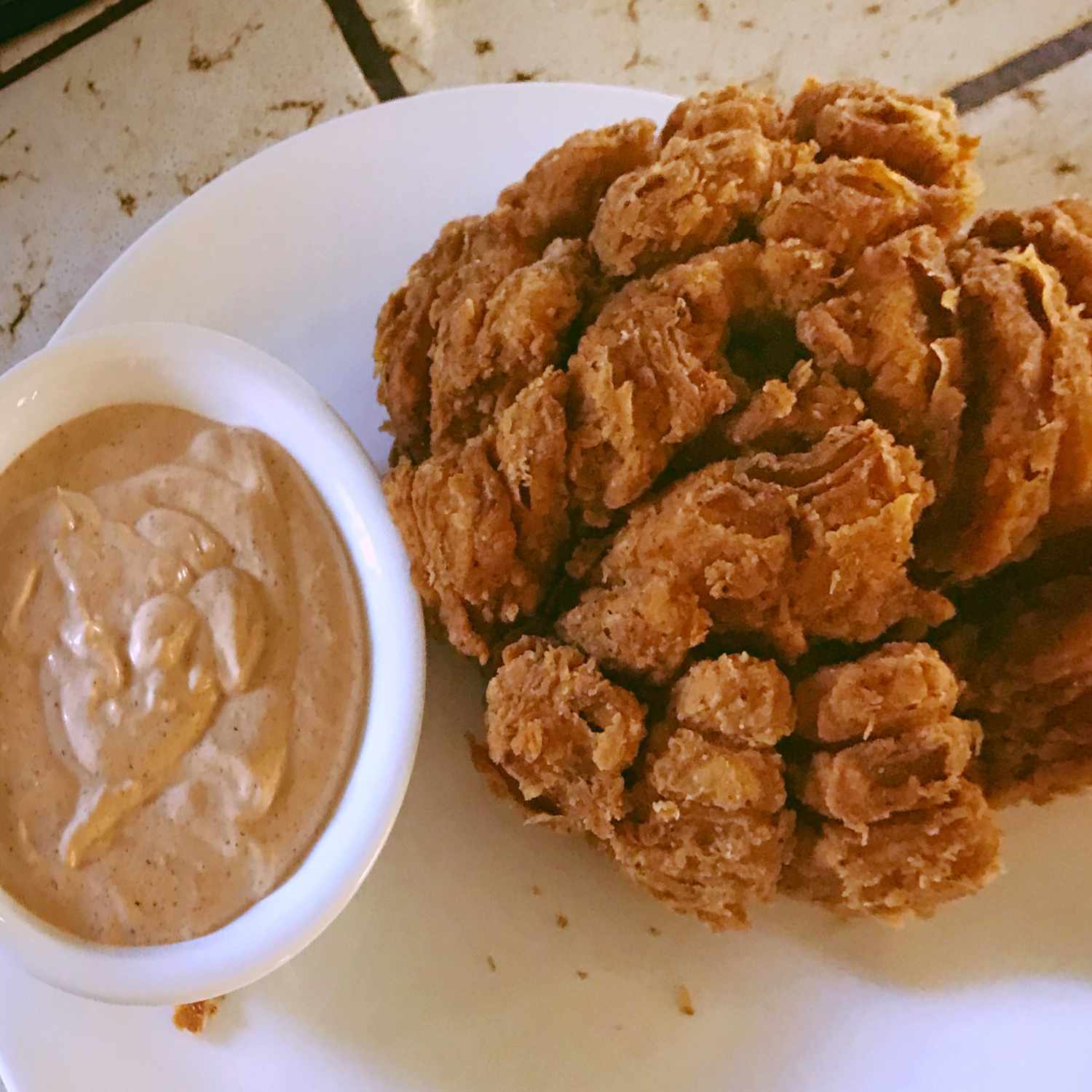 overhead view of Blooming Onion and Dipping Sauce in a bowl