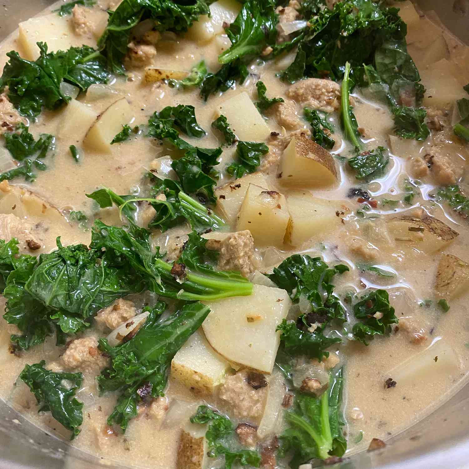 close up view of Sausage, Potato and Kale Soup in a bowl