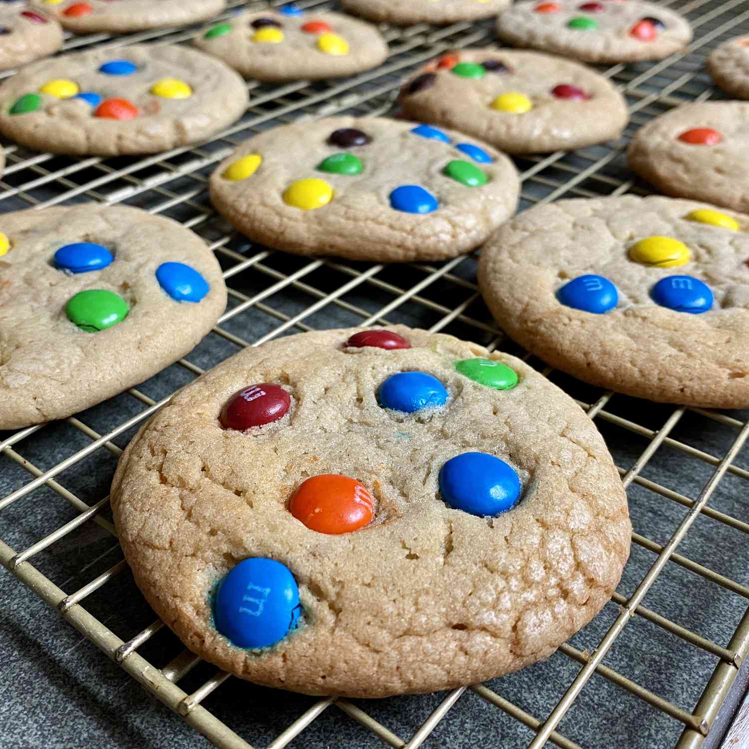 close up view of Robbi's M&Ms Cookies on a cooling rack