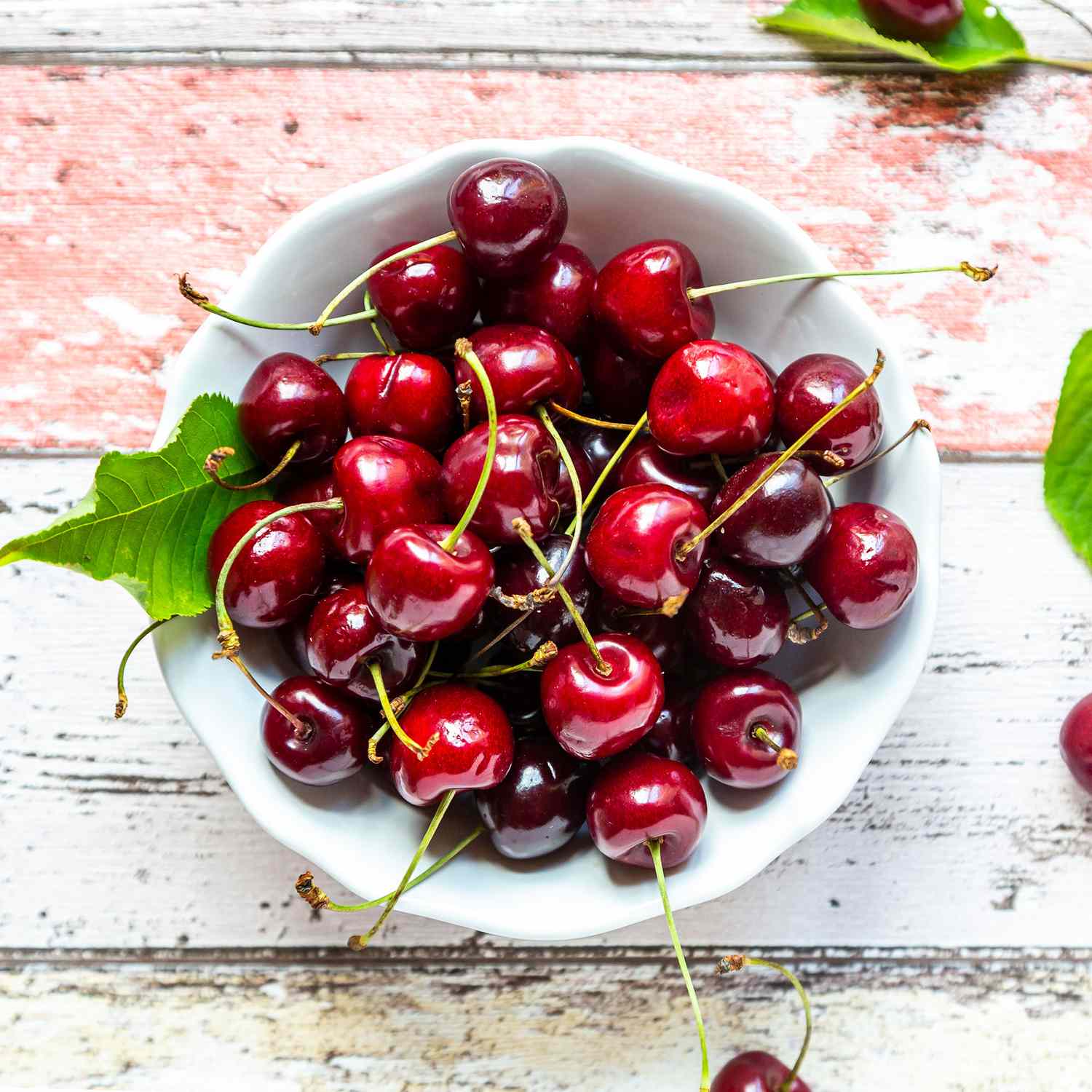 red cherries in a white bowl