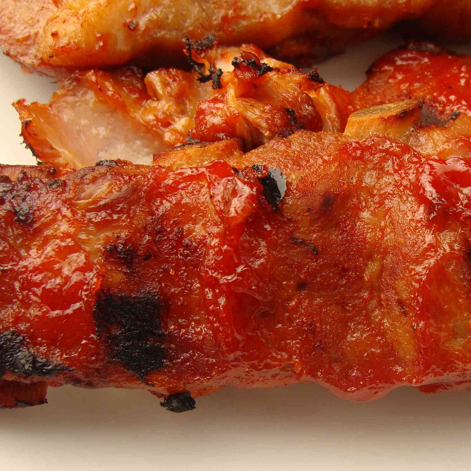 close up view of Bar-B-Que Sauce coated ribs