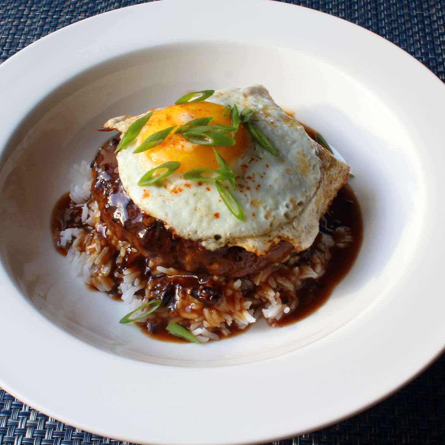 close up view of Chef John's Loco Moco garnished with green onions