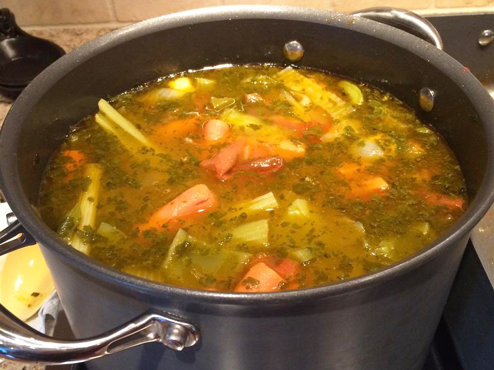 close up view of World's Greatest Vegetable Broth in a pot on a stove