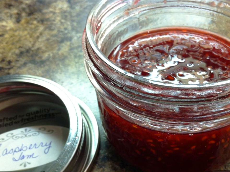 close up view of a jar with raspberry jam