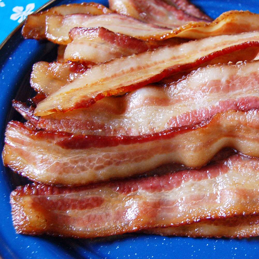 close up view of Oven-Baked Bacon on a blue plate