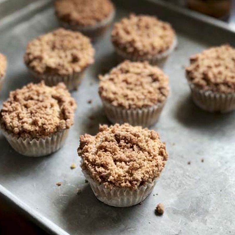 close up view of Apple Cinnamon Muffins on a metal baking sheet