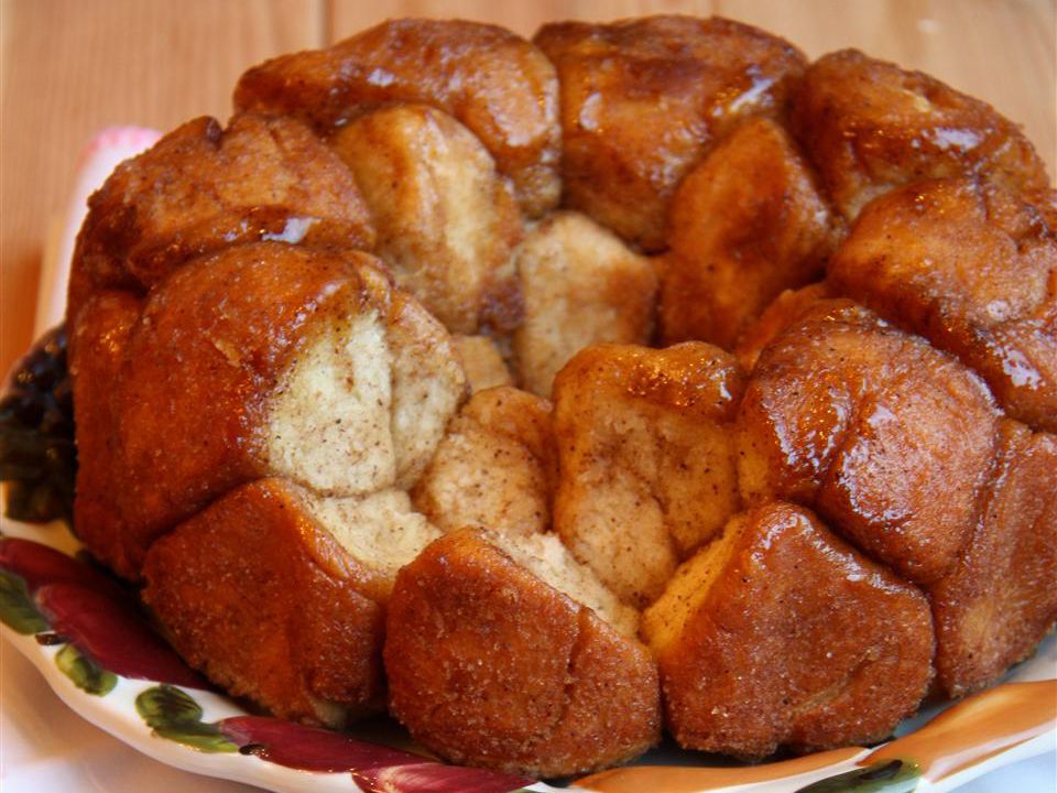 close up view of monkey bread, with pieces missing, on a platter