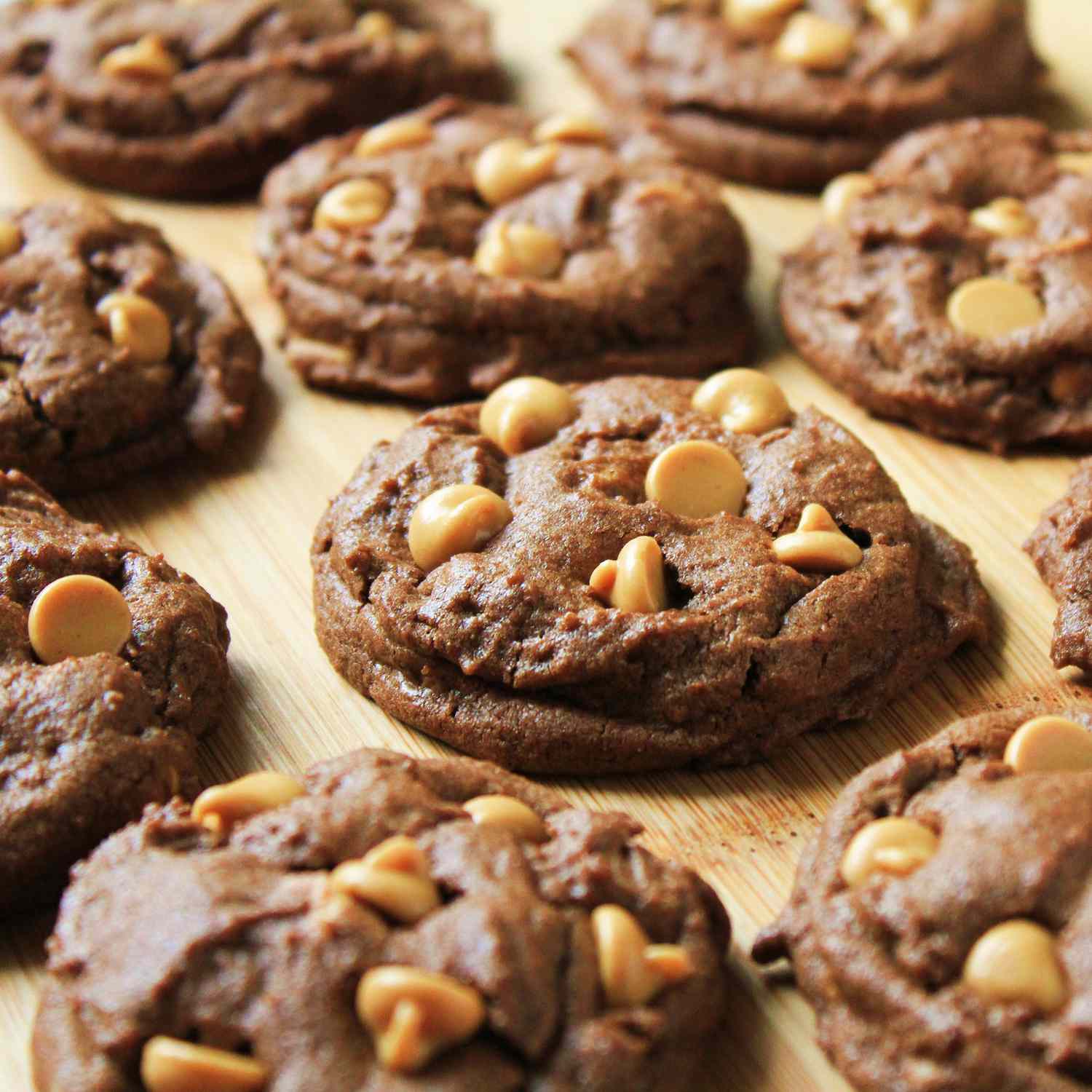 close up view of Peanut Butter Chip Chocolate Cookies on a wooden surface