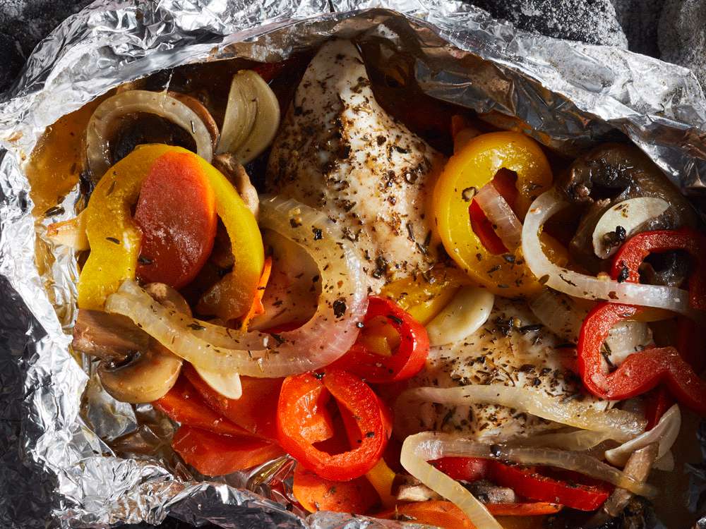 close up view of peppers, onions and chicken in a Campfire Foil Pack