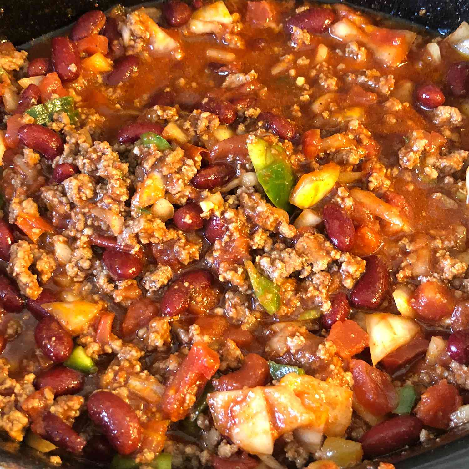 close up view of spicy chili in a slow cooker